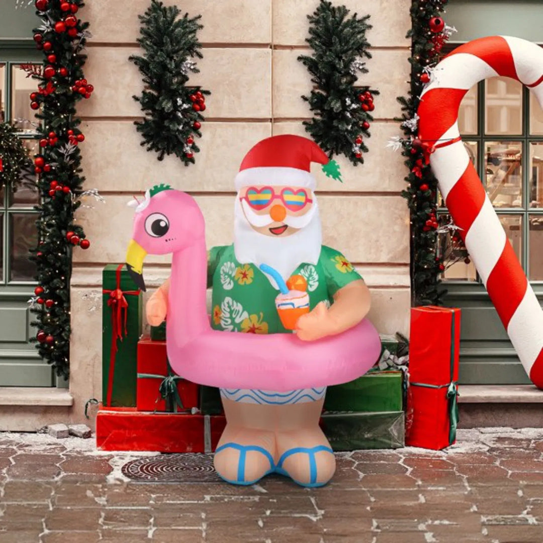 Dmuchany Mikołaj na różowym flamingu