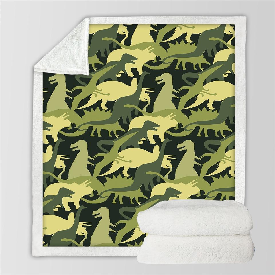 Kocyk z dinozaurami na łóżku dziecka