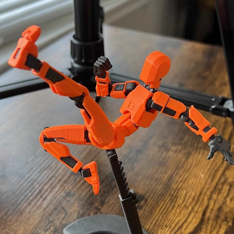 Pomarańczowy ruchomy robot z druku 3D