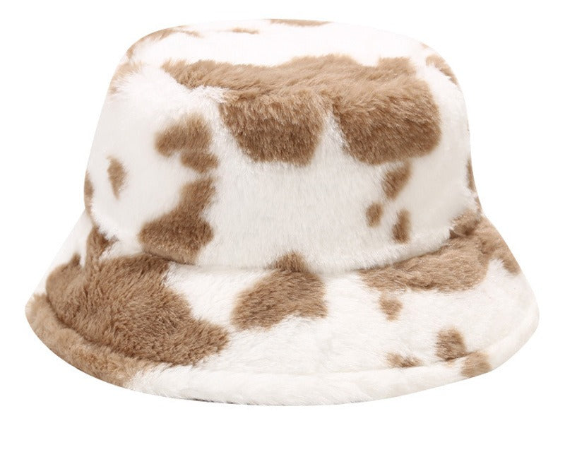 Puszysty kapelusz bucket w krowie łaty